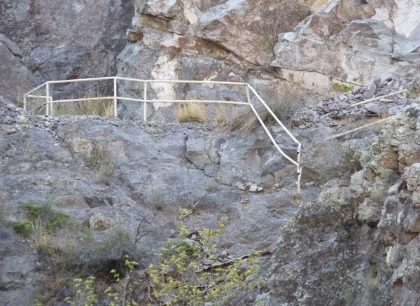 Railing hanging off cliff