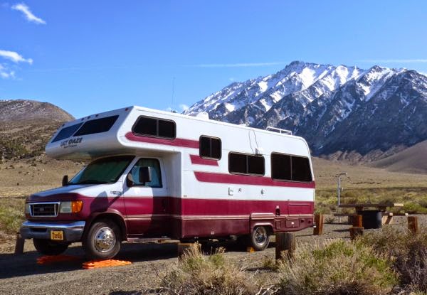 Motorhome camped by mountains