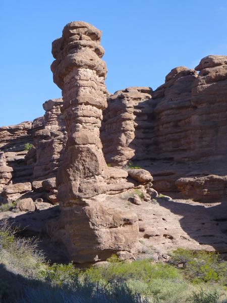 Pillar rock against cliffs