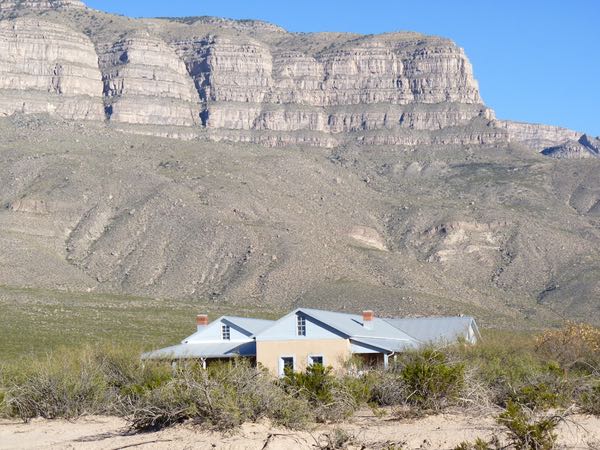 House, cliffs, desert