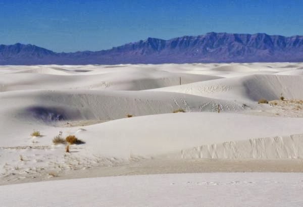 Sand dunes with mountains beyond