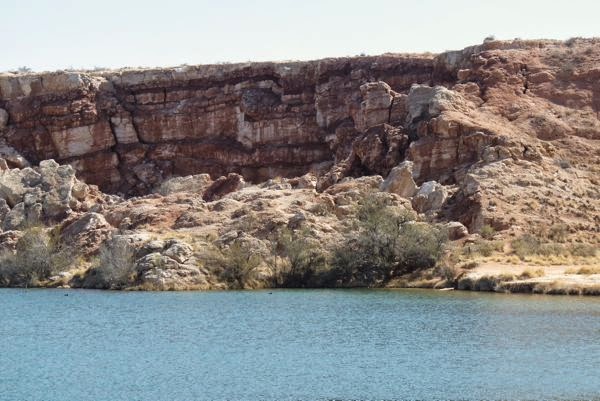 Lake with cliffs on far edge