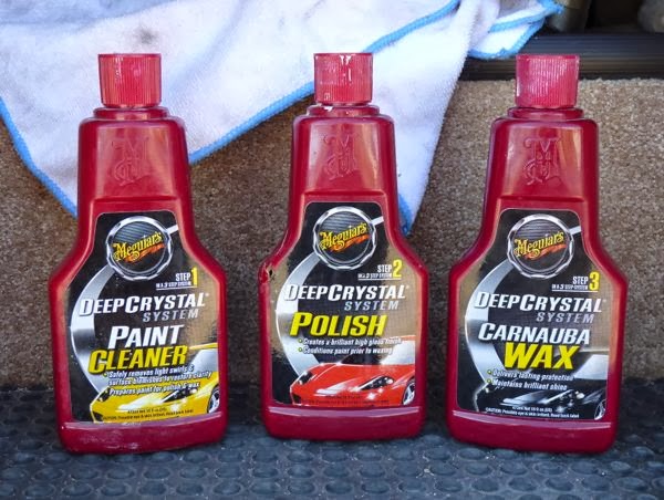 Three bottles of cleaner, polish and wax