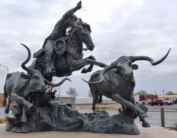 Sculpture of cattle and cowboy