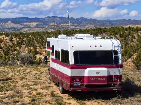 RV overlooking mountains with antenna