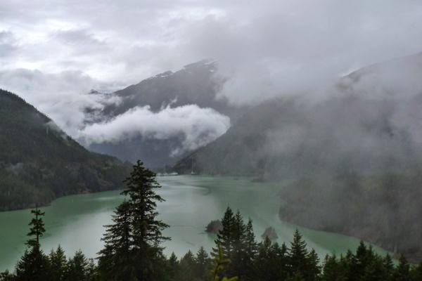 Lake with cloud shrouded mountains