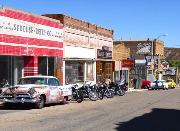 Old cars, motorcycles  and store fronts