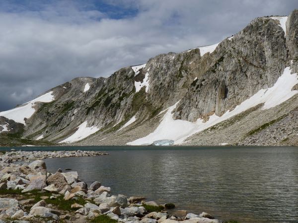 Lake, mountains, rocks, snow