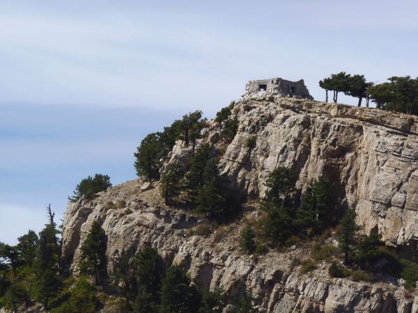 Cliff, cabin, trees