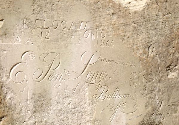 Inscriptions on rock wall